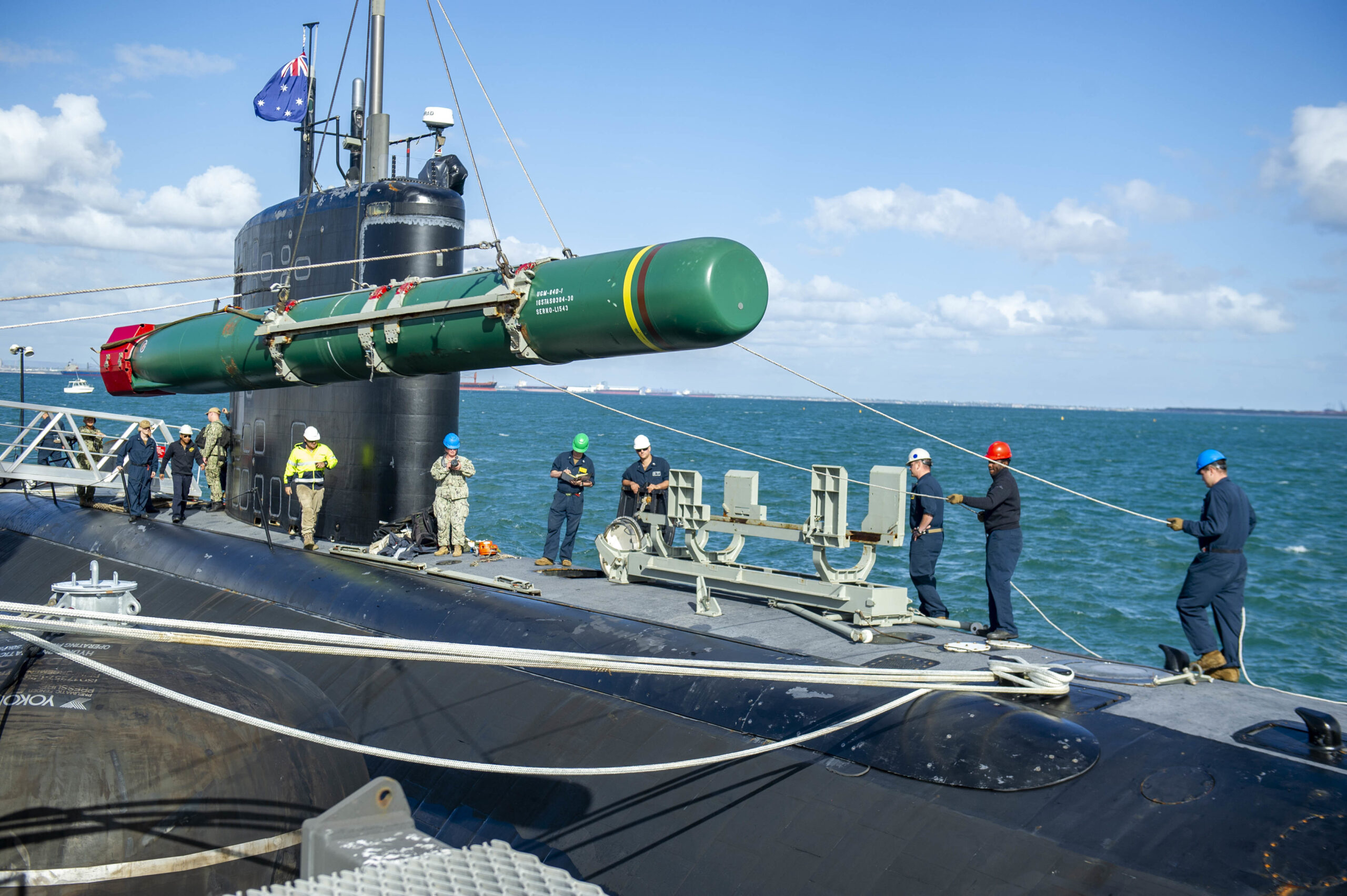 Sailors assigned to the <em>Los Angeles</em> submarine USS <em>Springfield</em> (SSN-761), participate in a weapons-handling exercise with a Harpoon inert training shape while the submarine is pierside at Royal Australian Navy base HMAS Stirling on Garden Island off the coast of Perth, Australia, April 28, 2022. <em>U.S. Navy photo by Mass Communication Specialist Seaman Wendy Arauz</em>